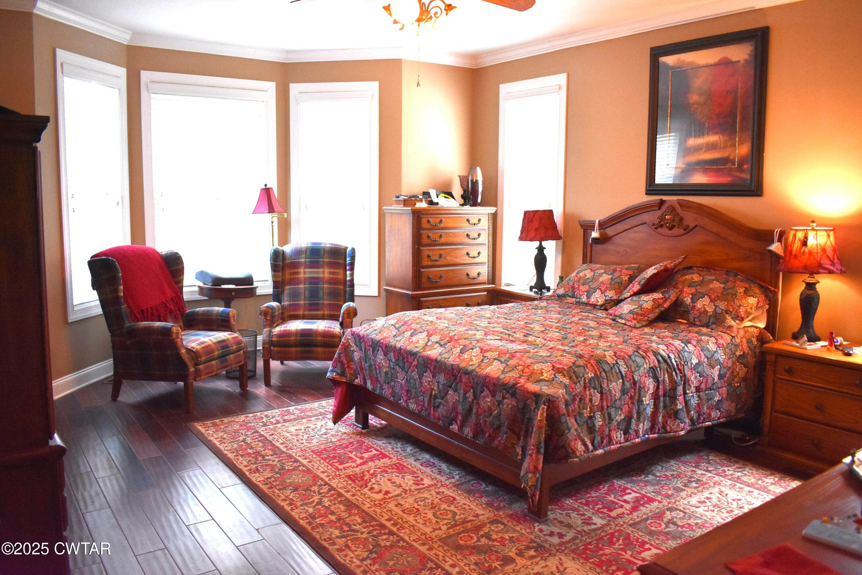 715 Roundtree Lane Beech Bluff, TN 38313 - Photo 15 of 24 a bed sitting in a bedroom next to a window