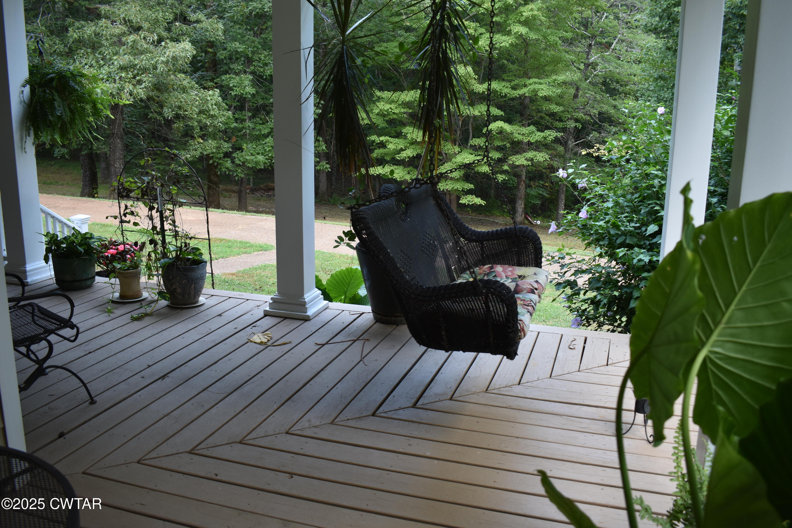 715 Roundtree Lane Beech Bluff, TN 38313 - Photo 23 of 24 a view of a wooden deck and a patio
