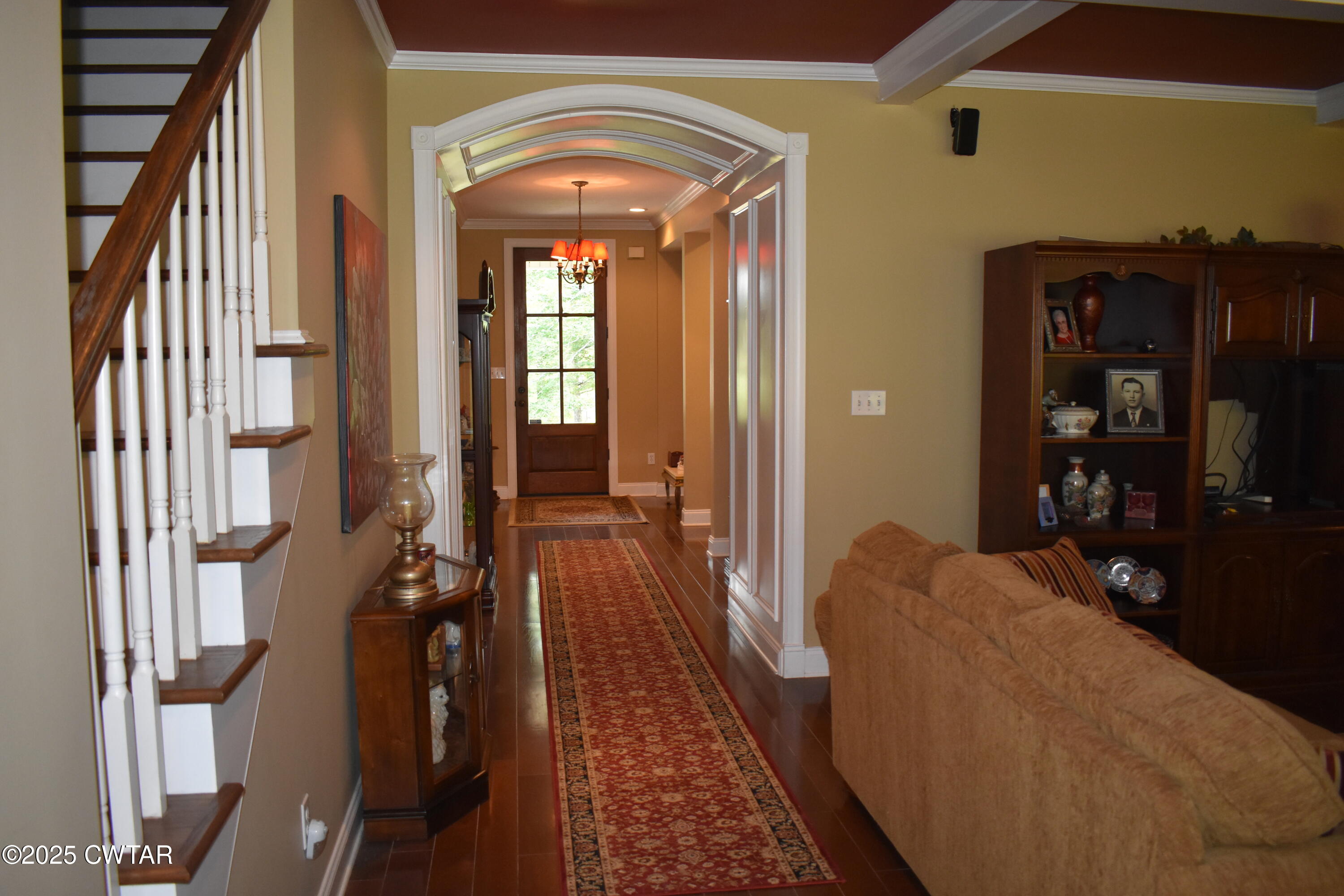 715 Roundtree Lane Beech Bluff, TN 38313 - Photo 8 of 24 a living room with furniture and a fireplace