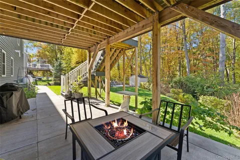 a view of a chairs and table in the patio