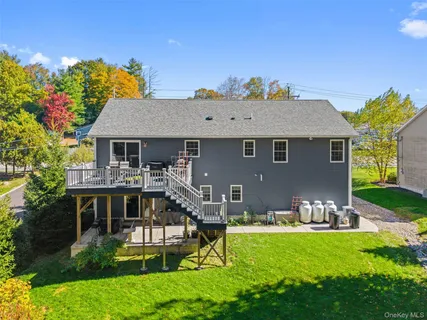 a front view of house with a garden and patio