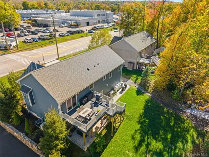 an aerial view of a house with swimming pool