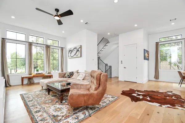 a living room with furniture and a rug