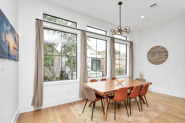 a view of a dining room with furniture window and outside view