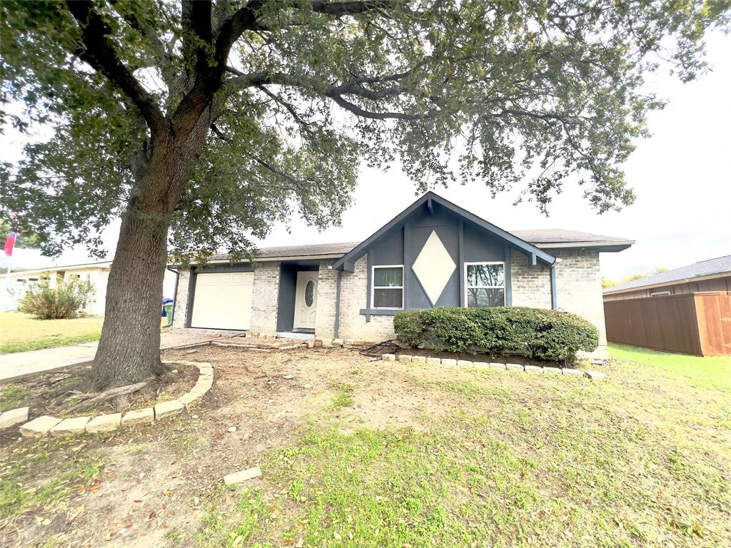 2902 Rayswood Drive Carrollton, TX 75007 - Photo 1 of 1 a front view of a house with a yard covered in snow