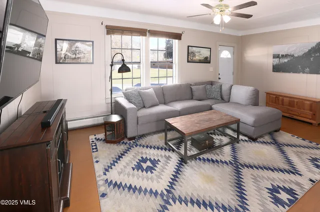 a kitchen with a refrigerator a stove top oven and a sink