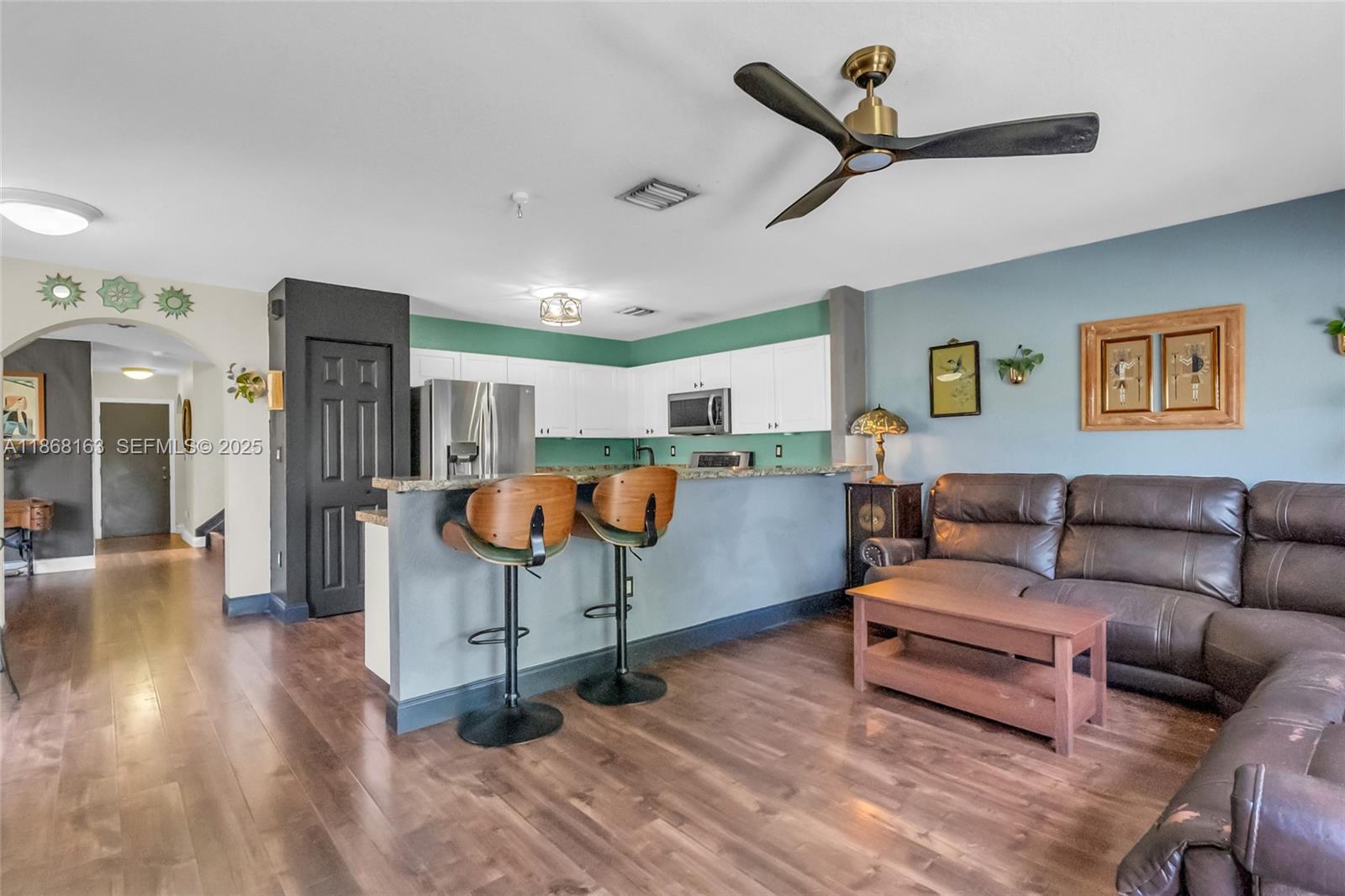 12160 Southwest 135th Terrace Miami, FL 33186 - Photo 13 of 46 a living room with furniture and kitchen view
