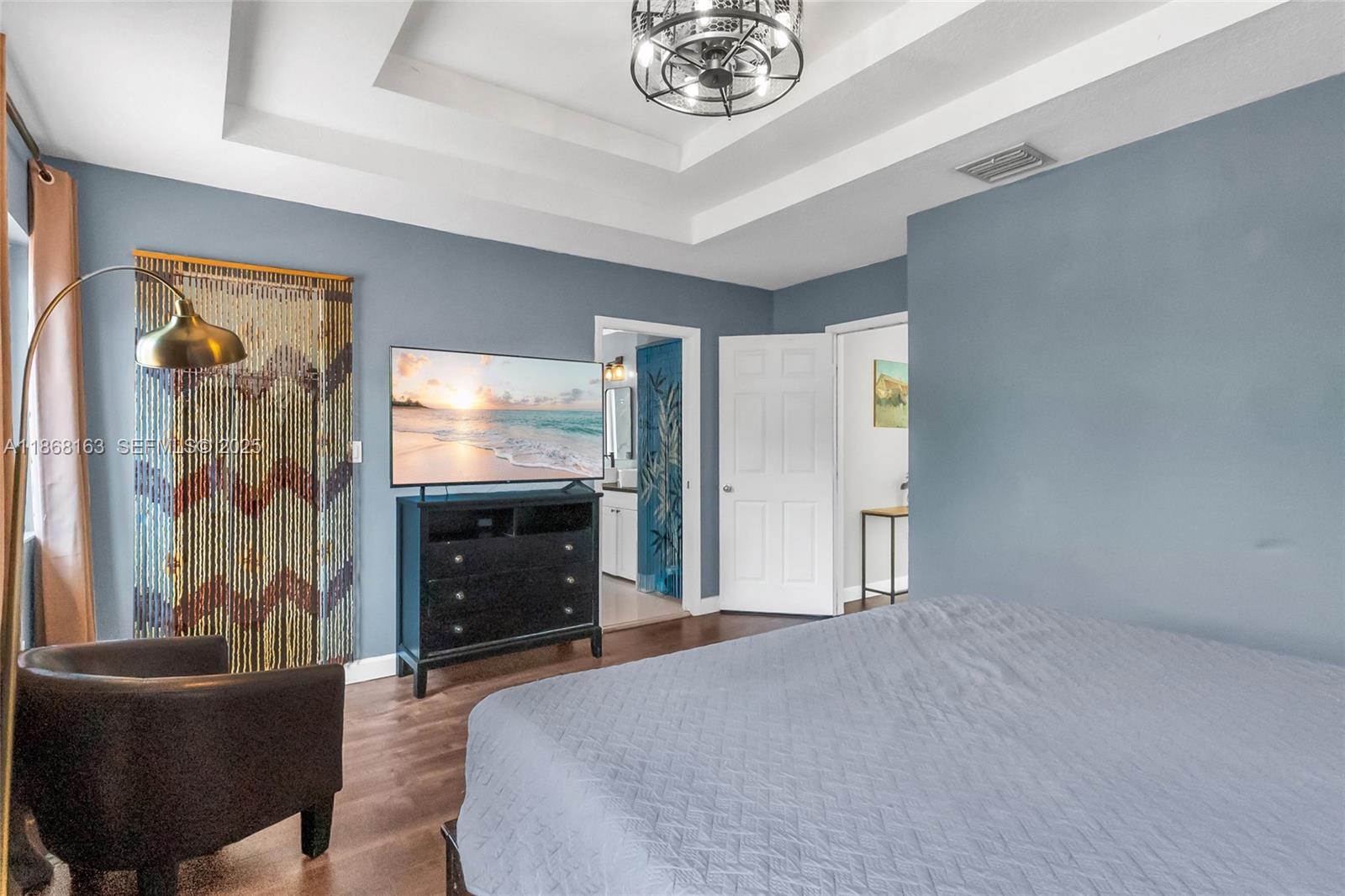 12160 Southwest 135th Terrace Miami, FL 33186 - Photo 18 of 46 a bedroom with furniture and a flat screen tv