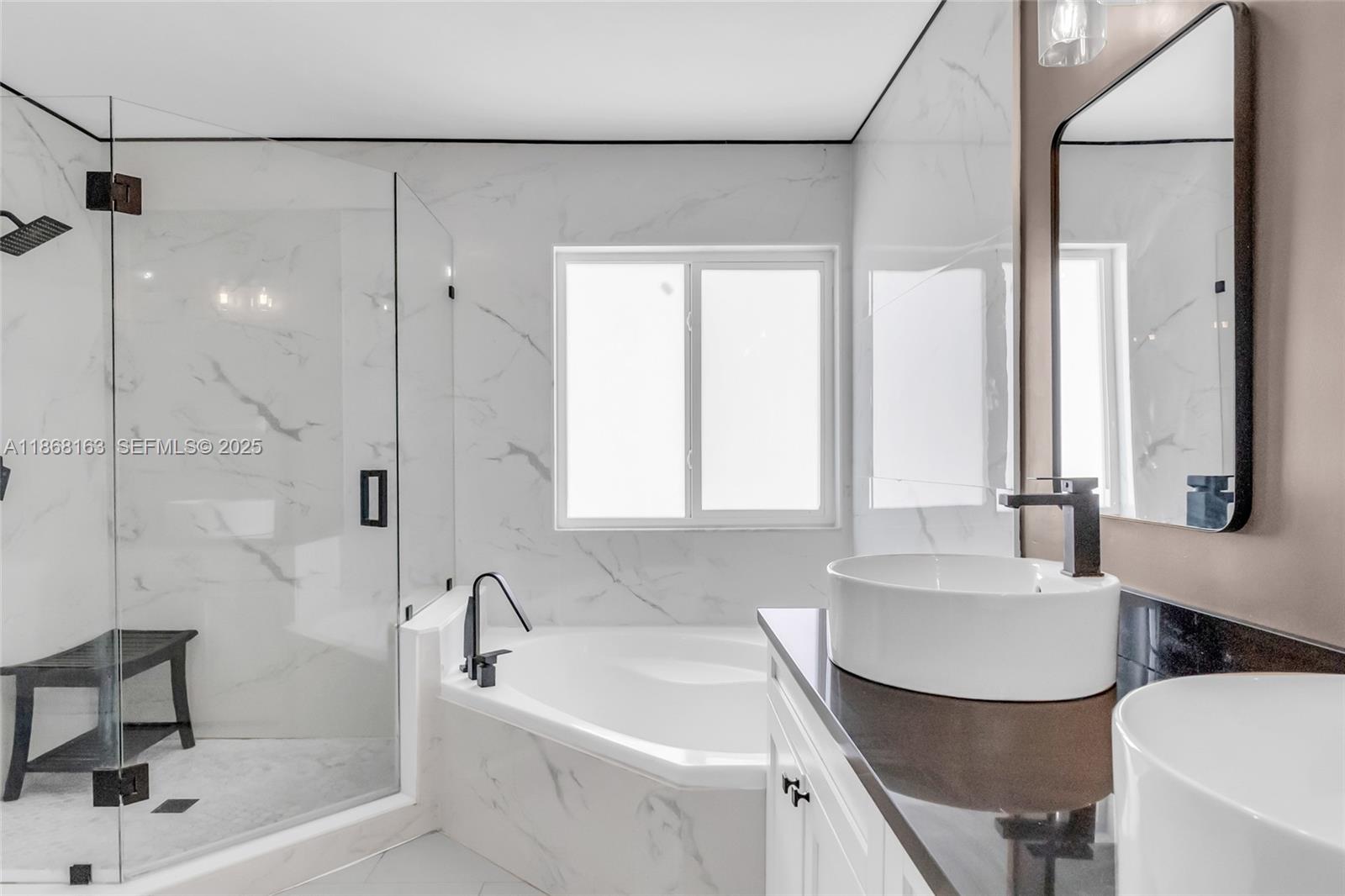 12160 Southwest 135th Terrace Miami, FL 33186 - Photo 19 of 46 a bathroom with a tub sink and mirror