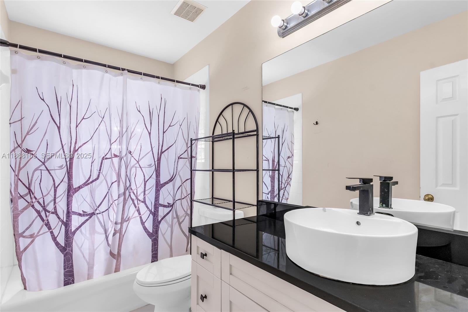 12160 Southwest 135th Terrace Miami, FL 33186 - Photo 24 of 46 a bathroom with a sink toilet and shower