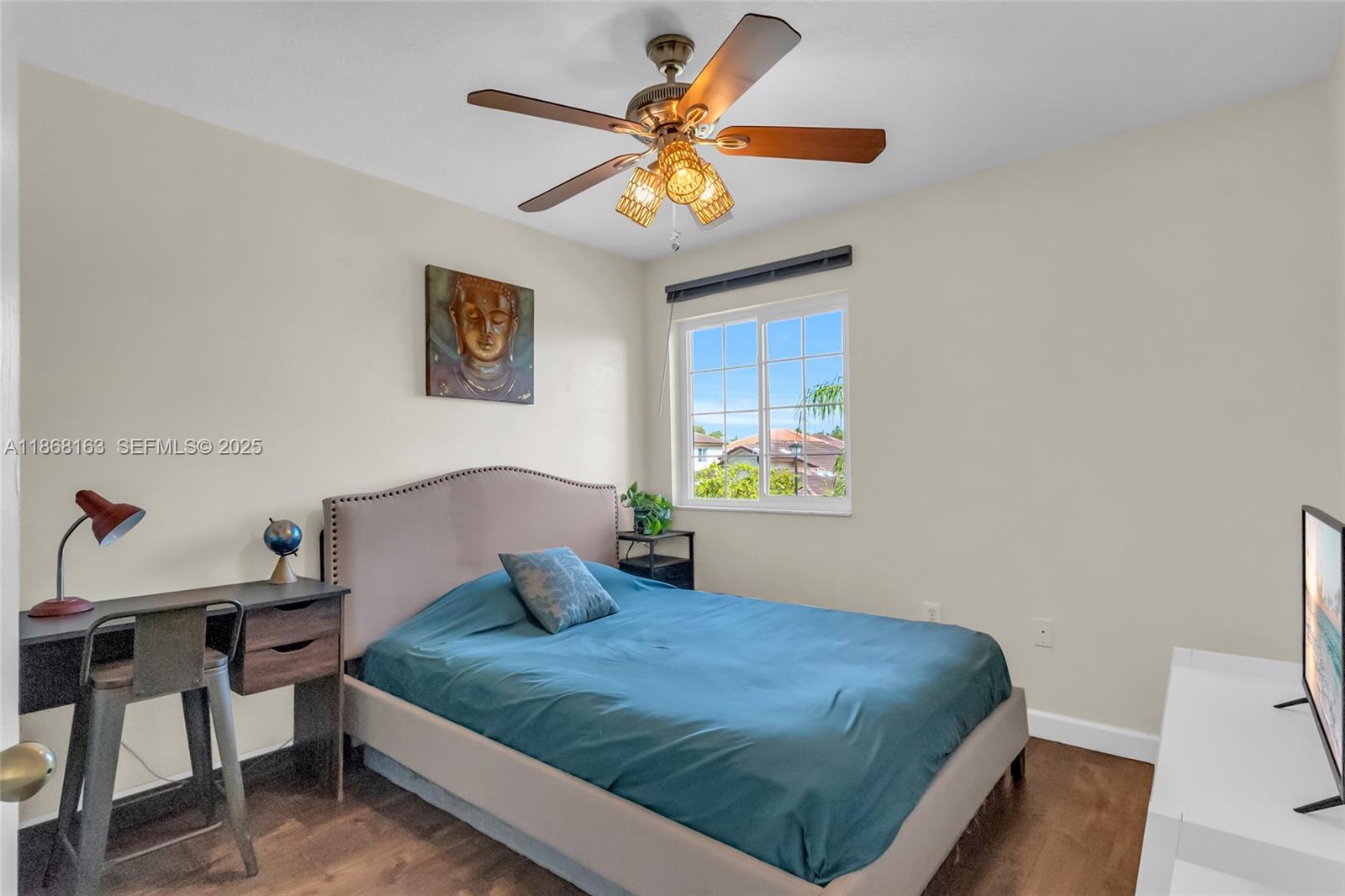 12160 Southwest 135th Terrace Miami, FL 33186 - Photo 25 of 46 a bedroom with a bed and a chandelier