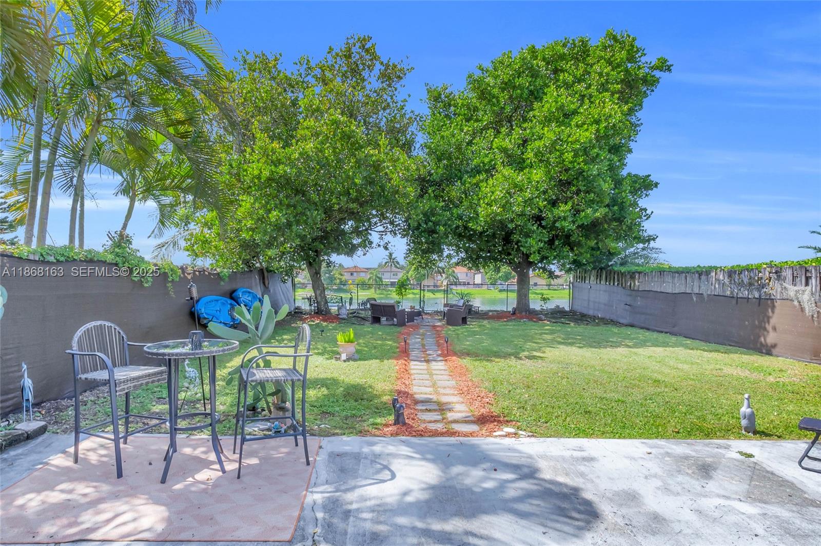 12160 Southwest 135th Terrace Miami, FL 33186 - Photo 29 of 46 a view of a chair and table in the garden