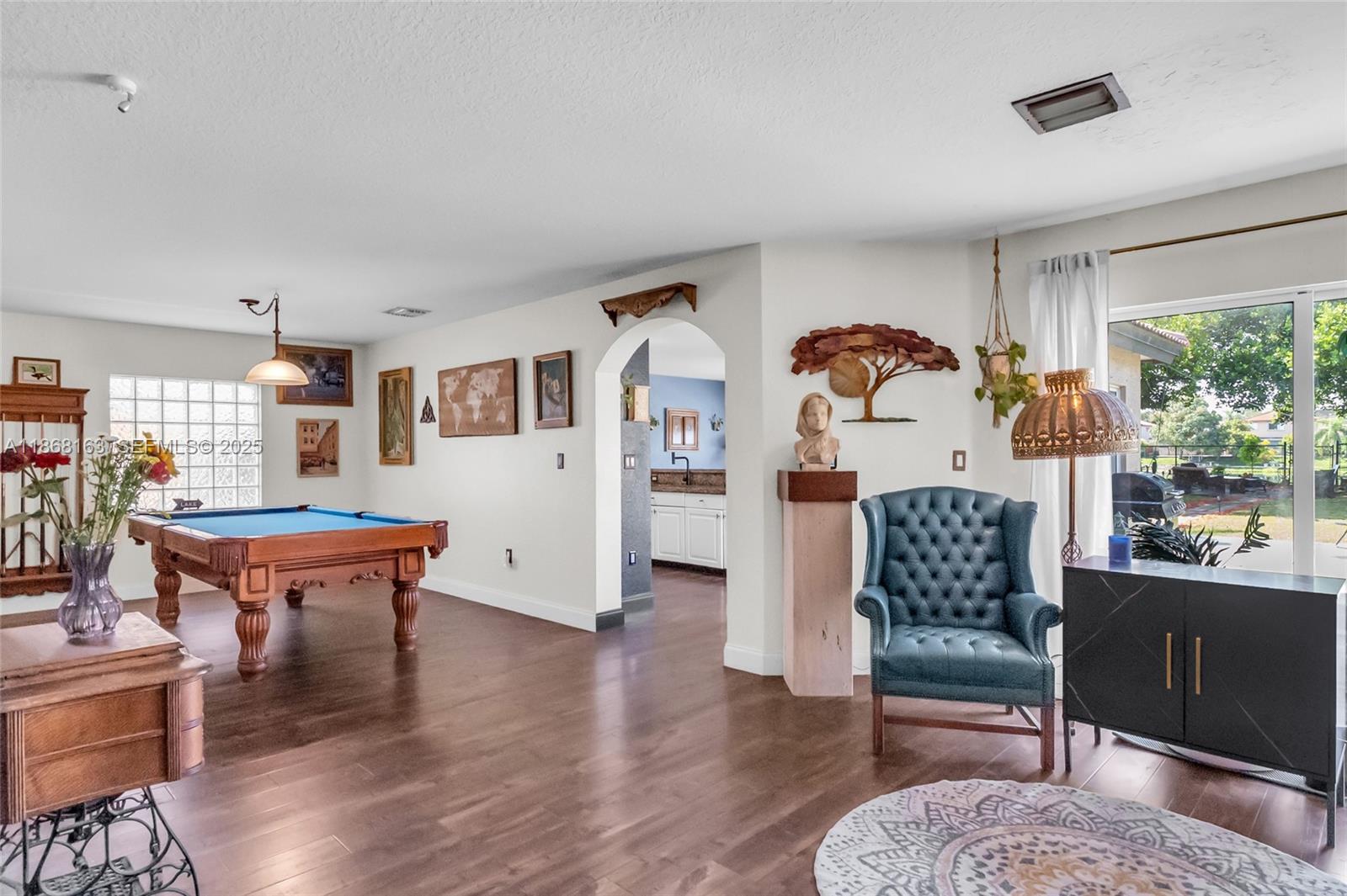 12160 Southwest 135th Terrace Miami, FL 33186 - Photo 3 of 46 a living room with furniture and wooden floor