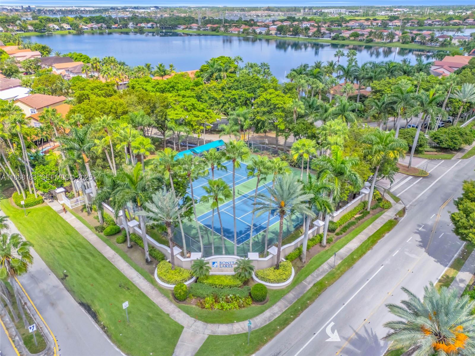 12160 Southwest 135th Terrace Miami, FL 33186 - Photo 33 of 46 a view of a lake with a house