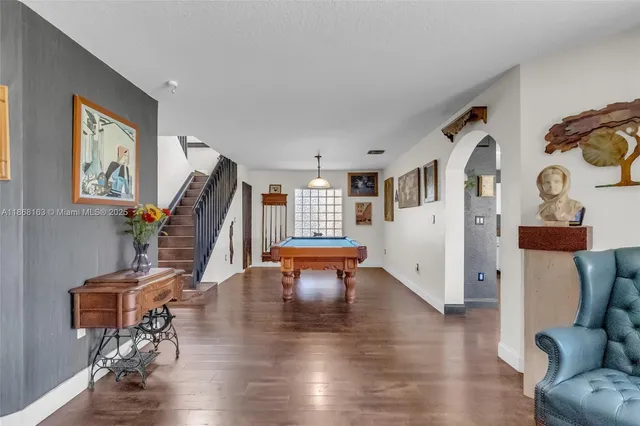 a view of a livingroom with furniture and a flat screen tv