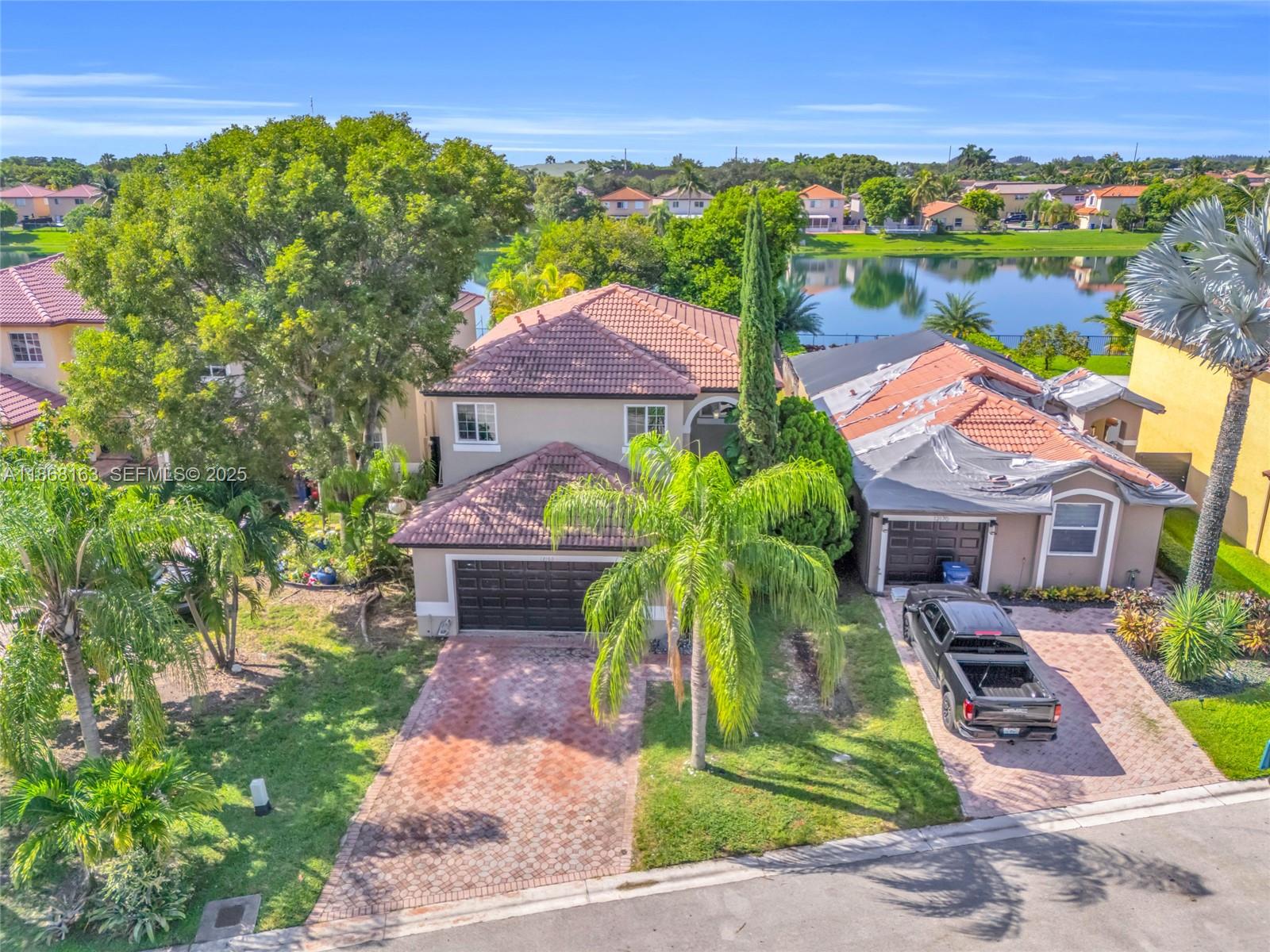 12160 Southwest 135th Terrace Miami, FL 33186 - Photo 41 of 46 a front view of house with yard and green space