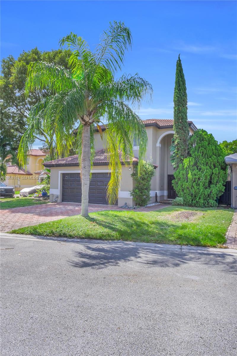 12160 Southwest 135th Terrace Miami, FL 33186 - Photo 44 of 46 a front view of a house with garden