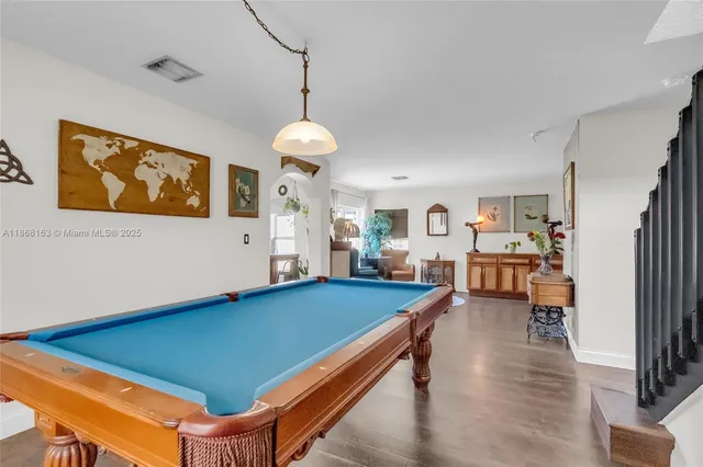 a room with furniture and wooden floor