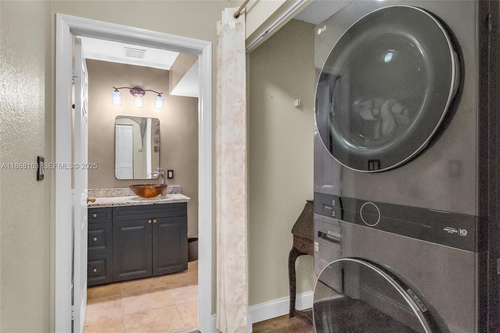 12160 Southwest 135th Terrace Miami, FL 33186 - Photo 6 of 46 a bathroom with a sink and a mirror