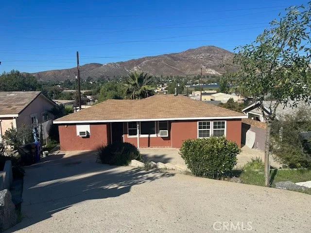 a view of a house with a street