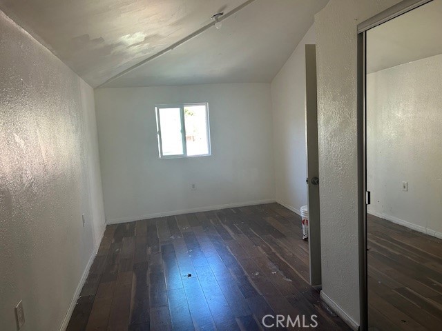 3483 Skylane Drive Riverside, CA 92509 - Photo 5 of 15 an empty room with wooden floor and windows