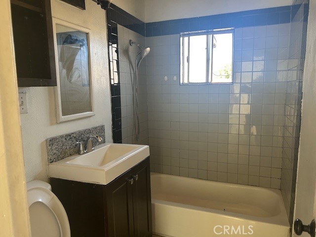 3483 Skylane Drive Riverside, CA 92509 - Photo 10 of 15 a bathroom with a sink a toilet and shower