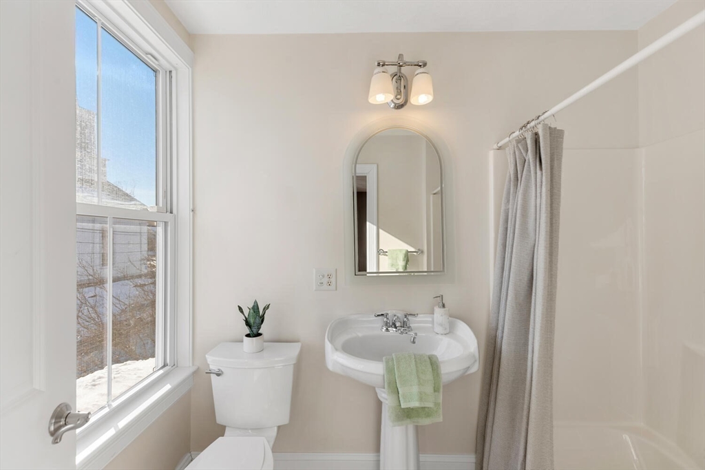 8 Common Street, Unit 3 Stoneham, MA 02180 - Photo 14 of 29 a bathroom with a sink toilet and shower