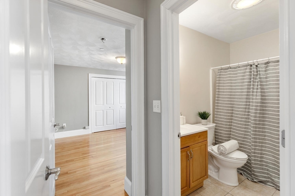 8 Common Street, Unit 3 Stoneham, MA 02180 - Photo 18 of 29 a bathroom with a toilet and a shower