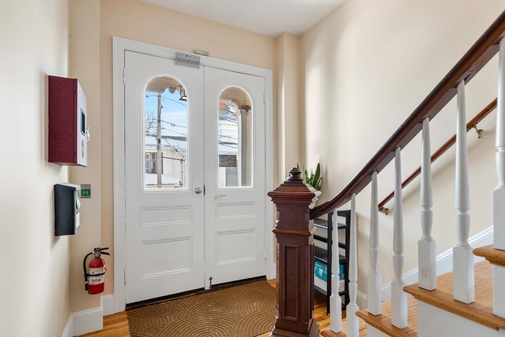 8 Common Street, Unit 3 Stoneham, MA 02180 - Photo 25 of 29 a view of entryway with wooden floor and stairs