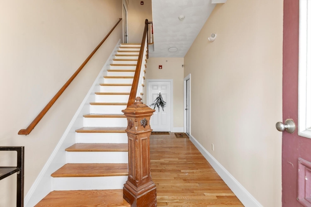 8 Common Street, Unit 3 Stoneham, MA 02180 - Photo 26 of 29 a view of entryway and gallery with wooden floor