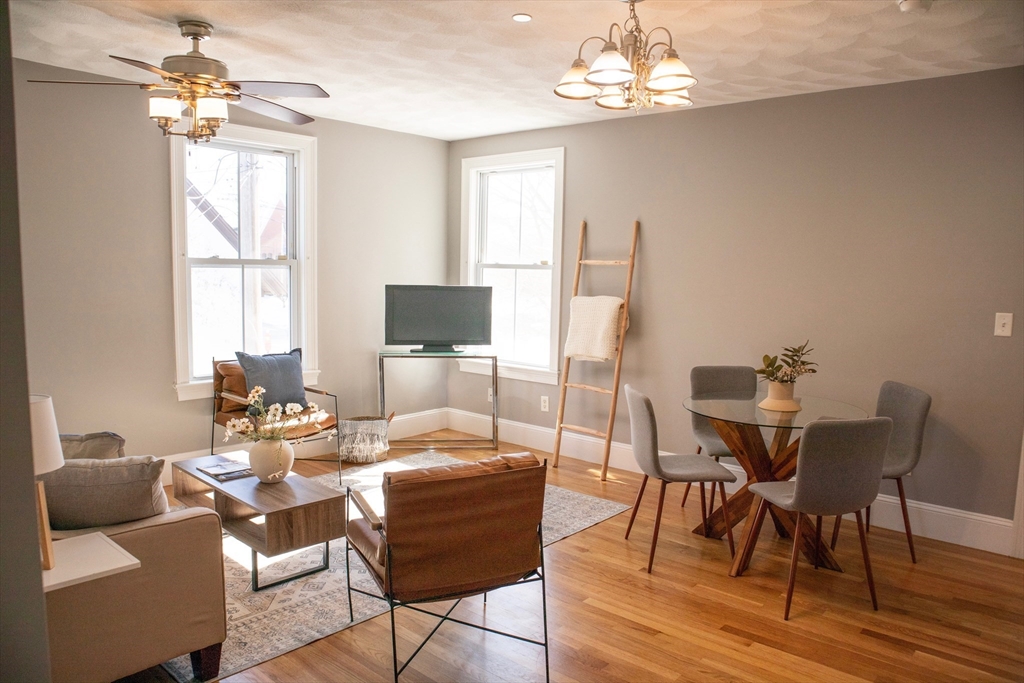 8 Common Street, Unit 3 Stoneham, MA 02180 - Photo 6 of 29 a view of a dining room with furniture window and outside view