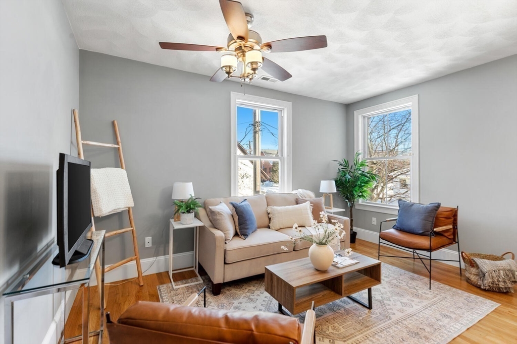 8 Common Street, Unit 3 Stoneham, MA 02180 - Photo 8 of 29 a living room with furniture and a flat screen tv