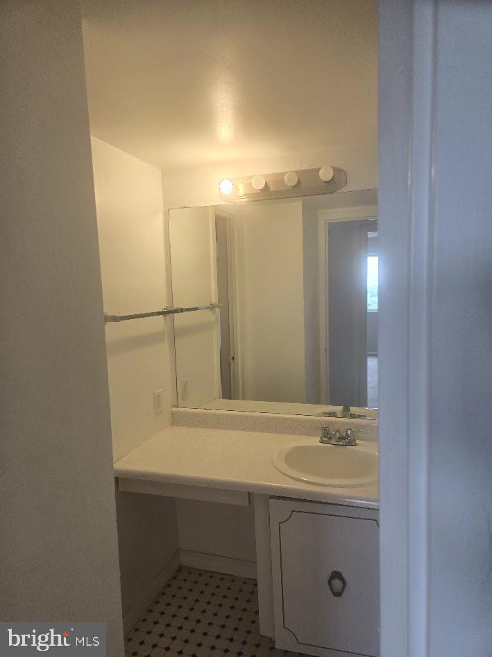 1836 Metzerott Road, Unit 1606 Hyattsville, MD 20783 - Photo 11 of 18 a bathroom with a sink and mirror