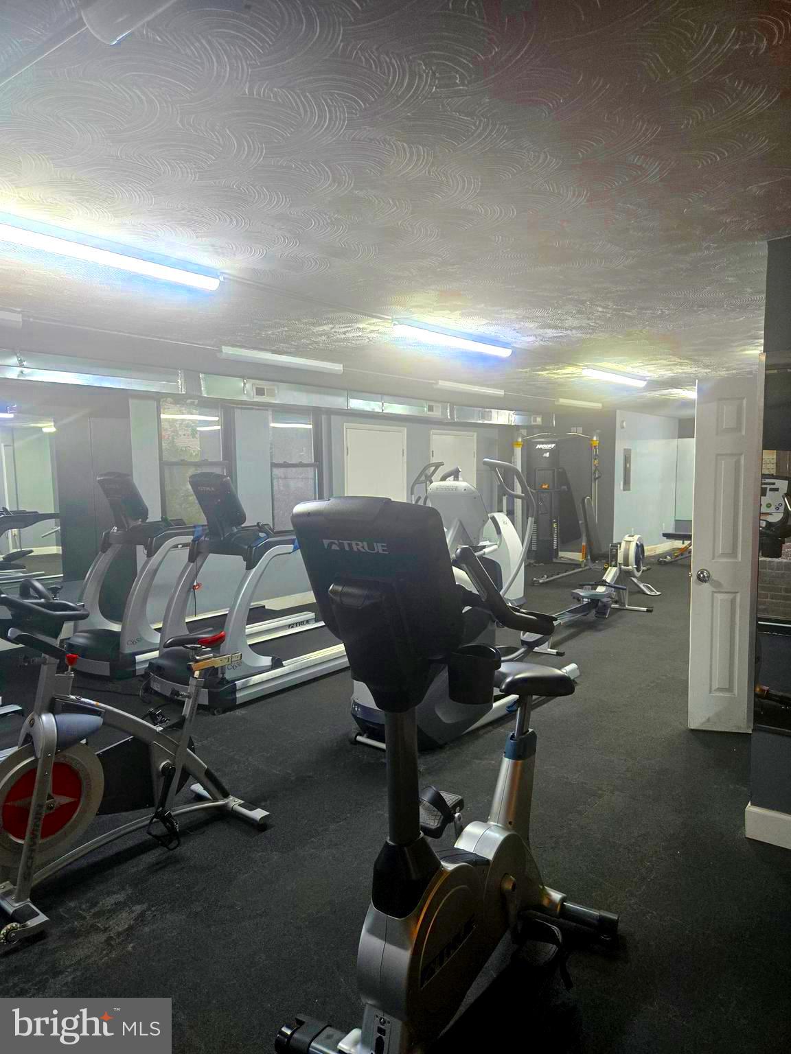 1836 Metzerott Road, Unit 1606 Hyattsville, MD 20783 - Photo 15 of 18 a view of a room with gym equipment