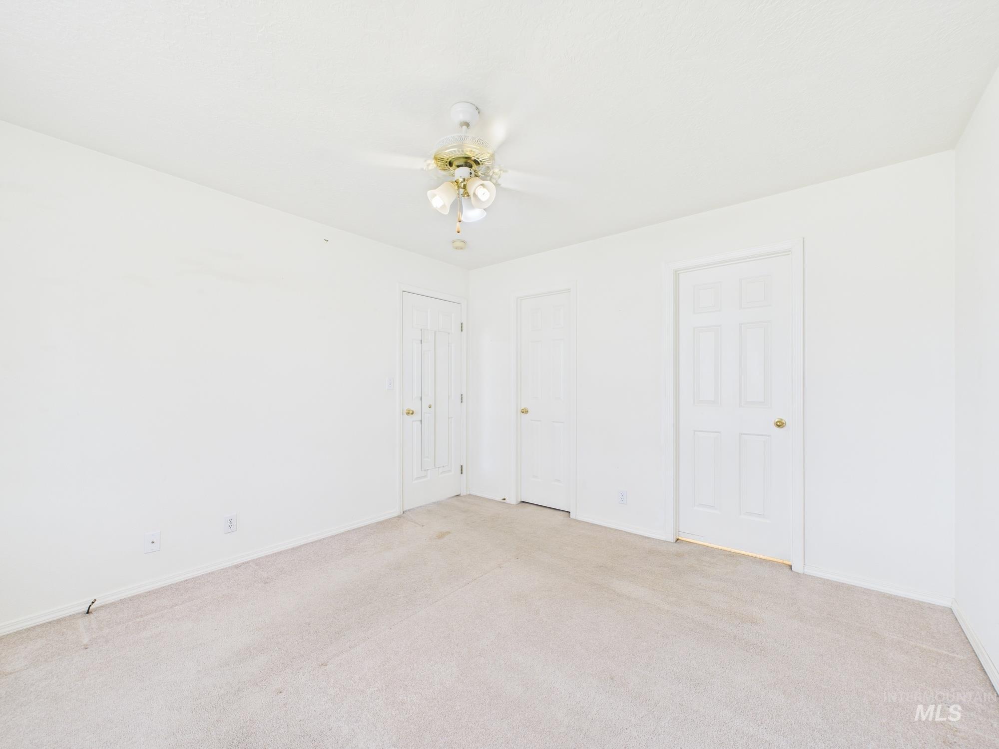 1786 North Plaza Road Emmett, ID 83617 - Photo 12 of 36 Unfurnished bedroom featuring carpet and ceiling fan