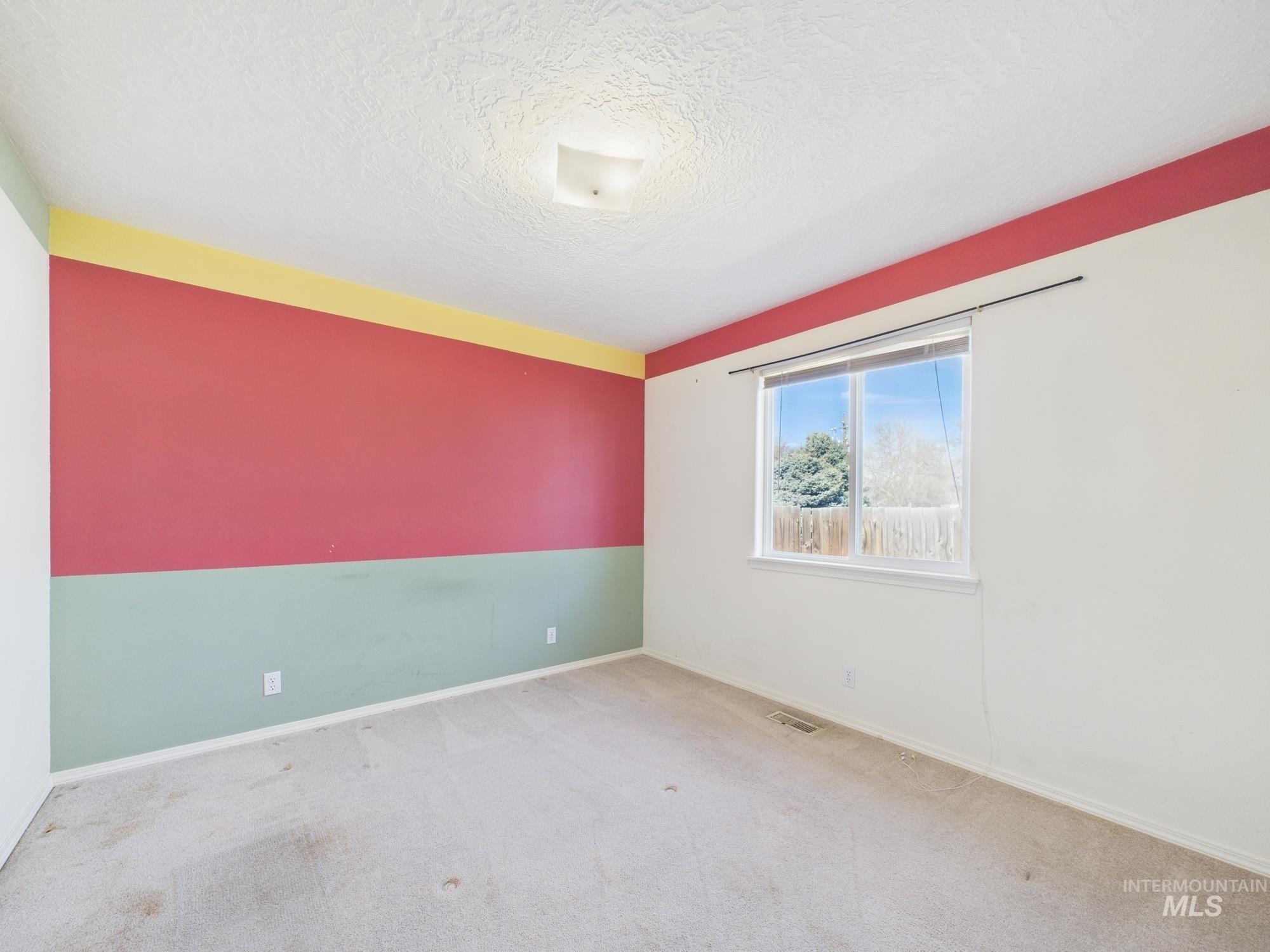 1786 North Plaza Road Emmett, ID 83617 - Photo 19 of 36 Unfurnished room with carpet floors and a textured ceiling