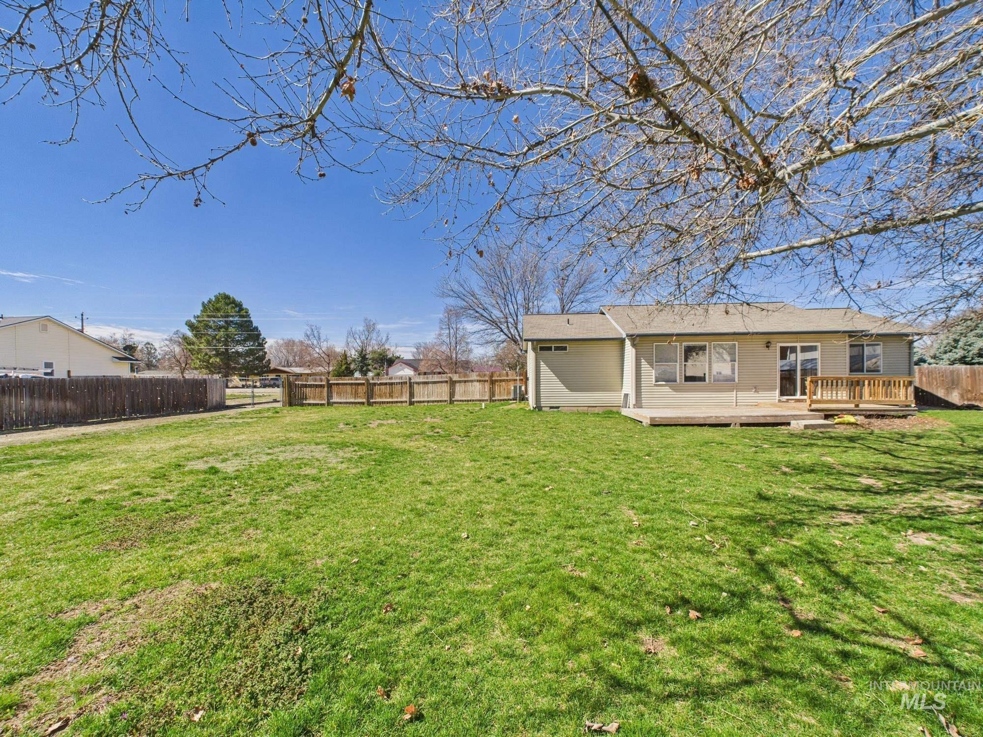 1786 North Plaza Road Emmett, ID 83617 - Photo 26 of 36 Fenced backyard featuring a wooden deck