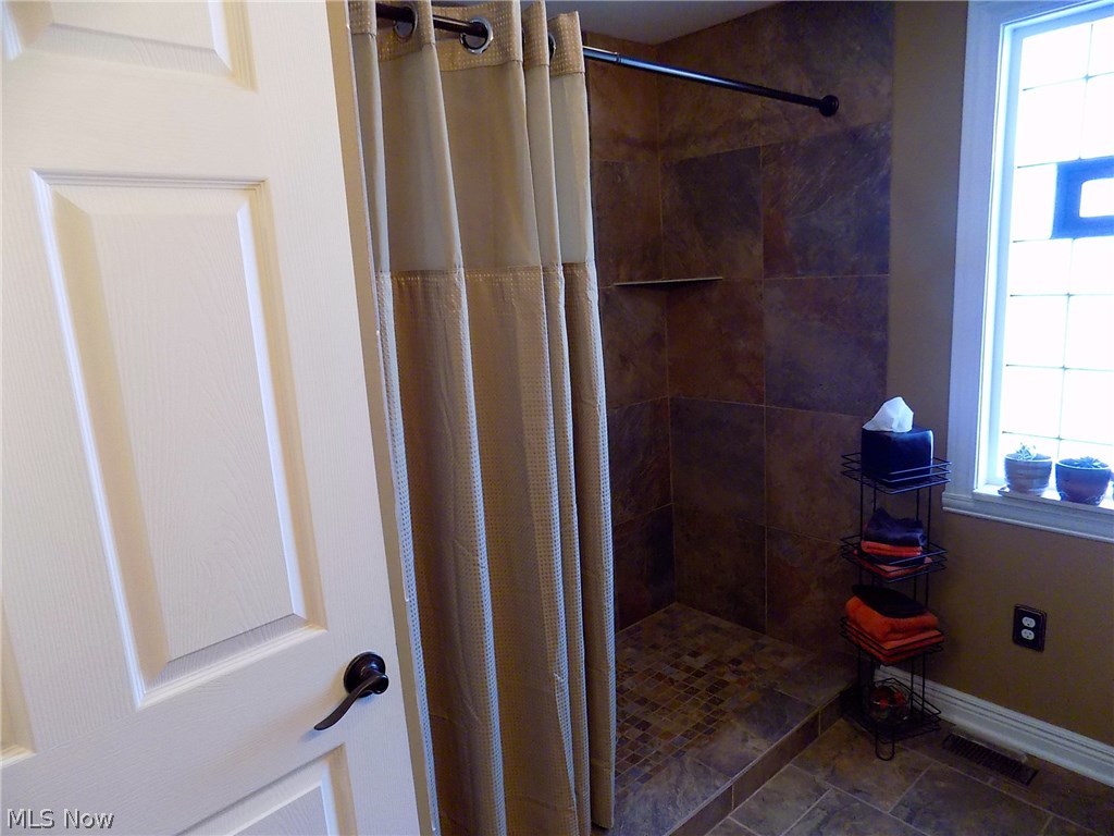25769 Butternut Ridge Road North Olmsted, OH 44070 - Photo 15 of 35 First floor bathroom with large walk-in tile shower.