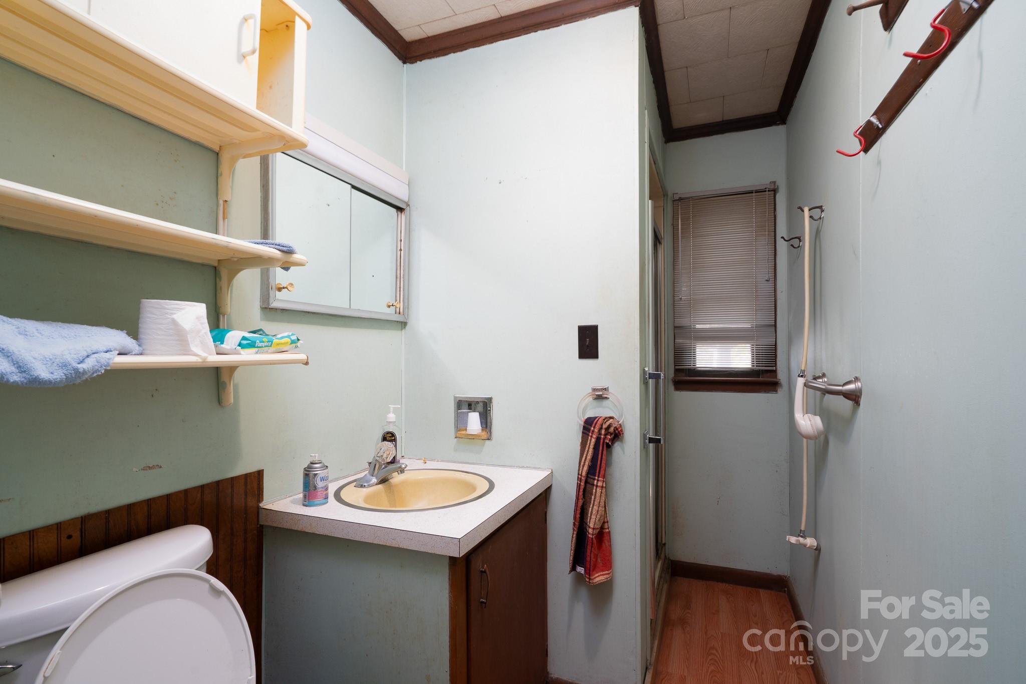 335 Richfield Road Richfield, NC 28137 - Photo 13 of 33 a bathroom with a sink and toilet