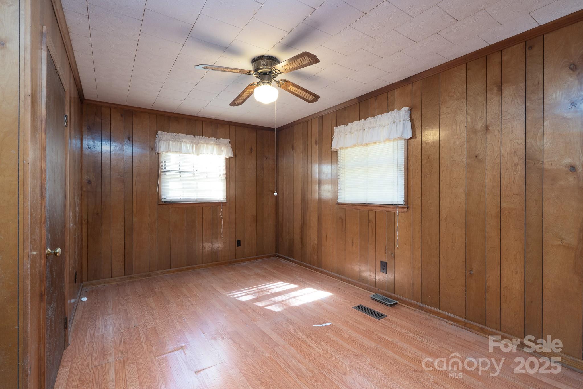335 Richfield Road Richfield, NC 28137 - Photo 14 of 33 wooden floor in an empty room with a window