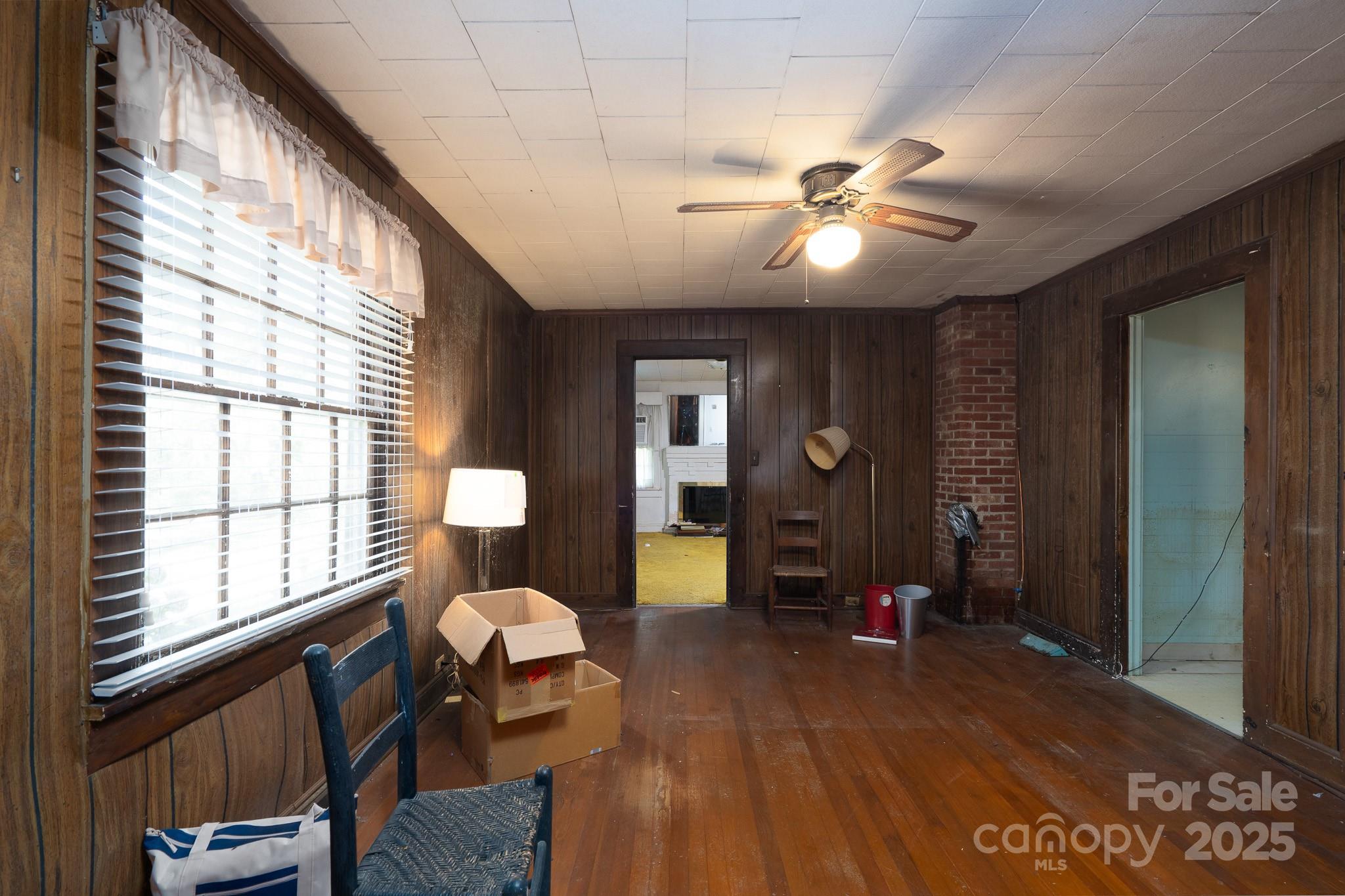 335 Richfield Road Richfield, NC 28137 - Photo 17 of 33 a living room with furniture two window and wooden floor