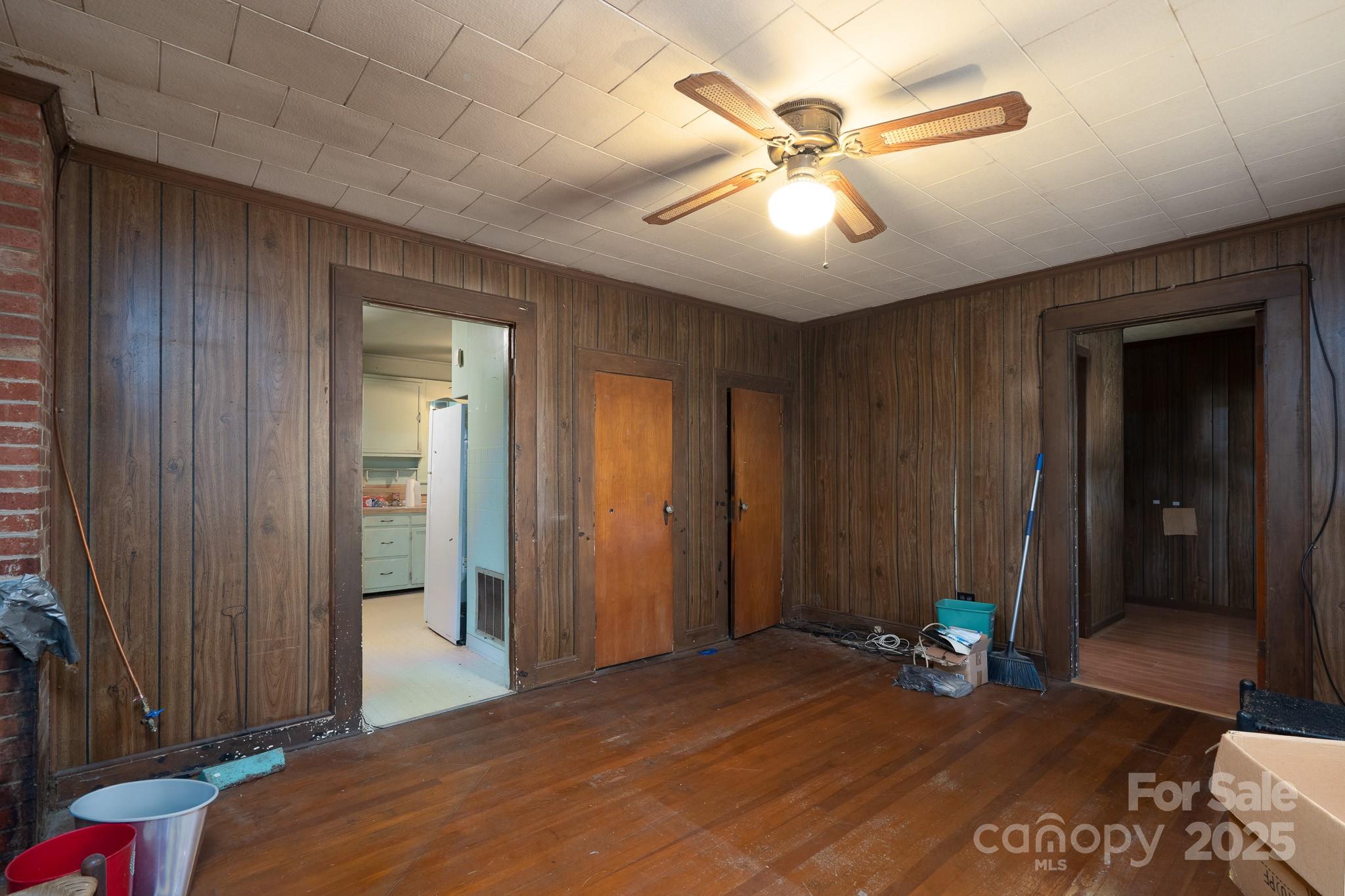 335 Richfield Road Richfield, NC 28137 - Photo 18 of 33 a bedroom with a bed and a chandelier