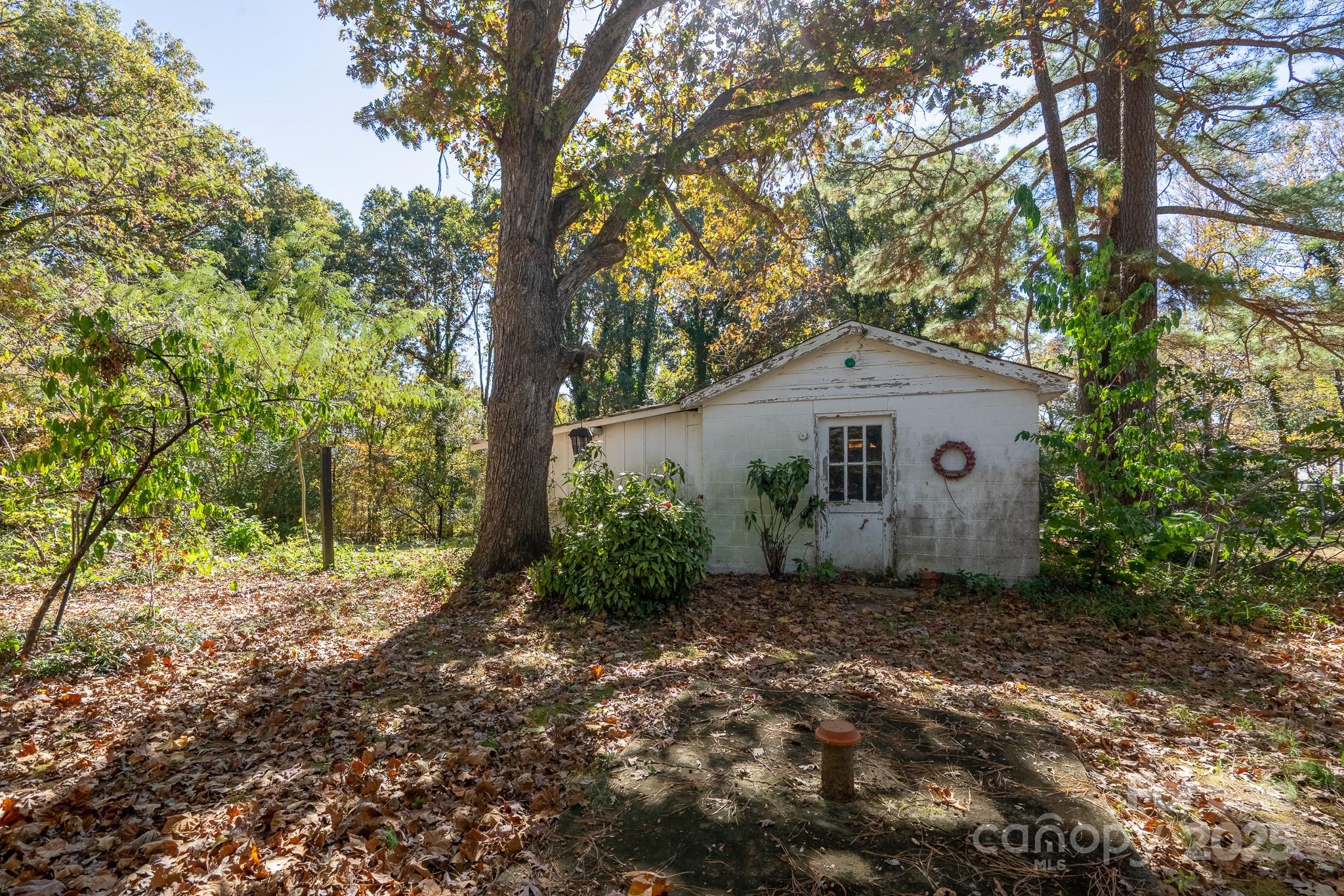 335 Richfield Road Richfield, NC 28137 - Photo 23 of 33 a view of a house with a tree in the background