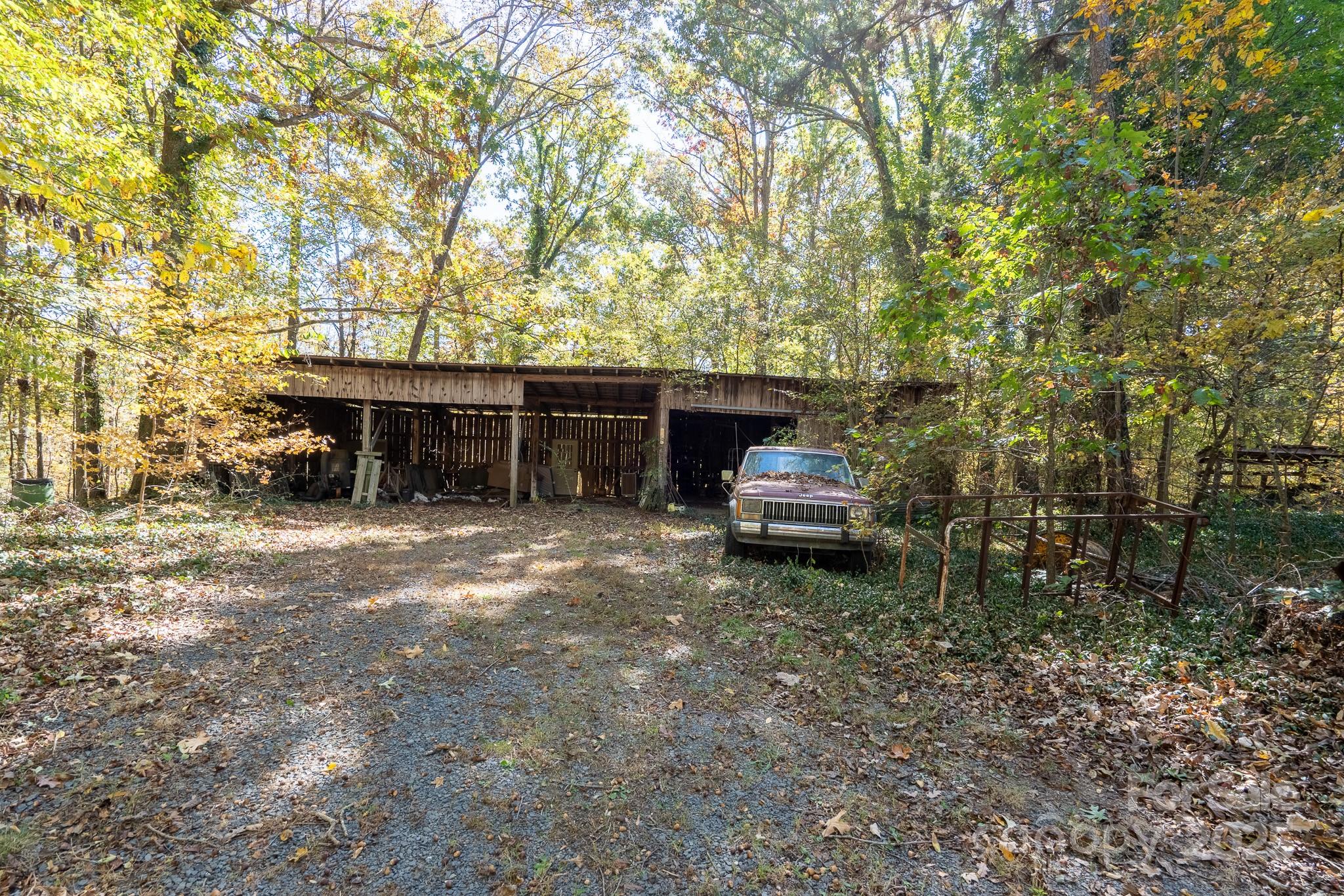 335 Richfield Road Richfield, NC 28137 - Photo 30 of 33 a front view of a house with a garden and trees