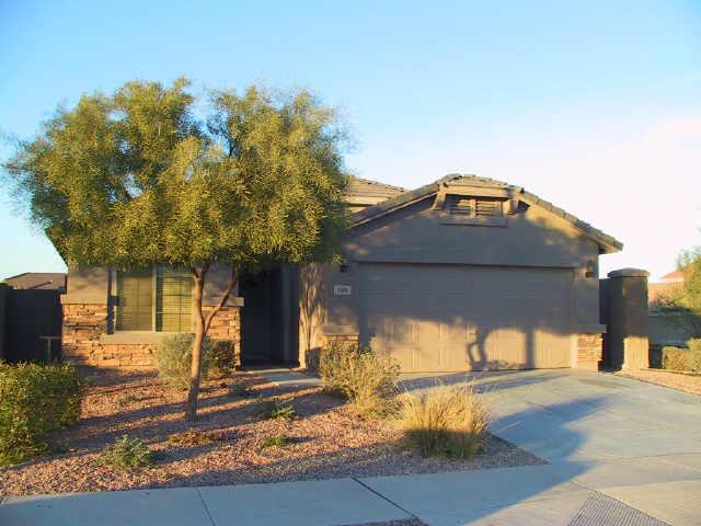 3606 West Vineyard Road Phoenix, AZ 85041 - Photo 1 of 7 a front view of a house with a yard