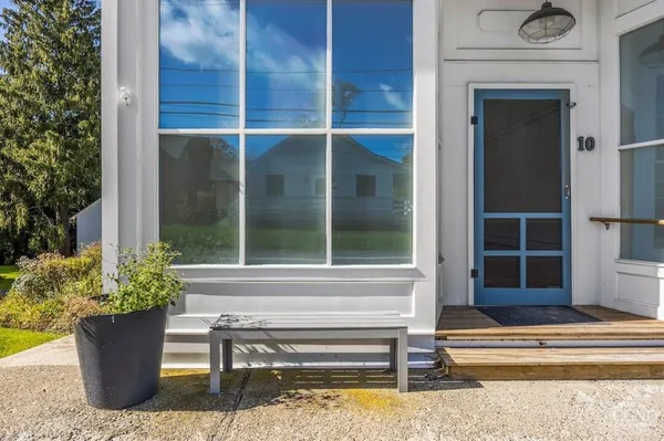 a view of fountain in front of a house