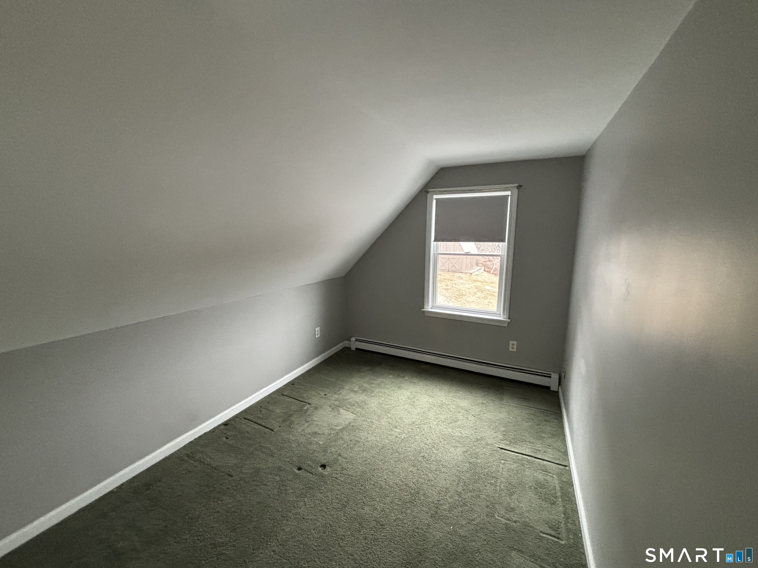 72 Ingham Hill Road Old Saybrook, CT 06475 - Photo 15 of 25 an empty room with a window