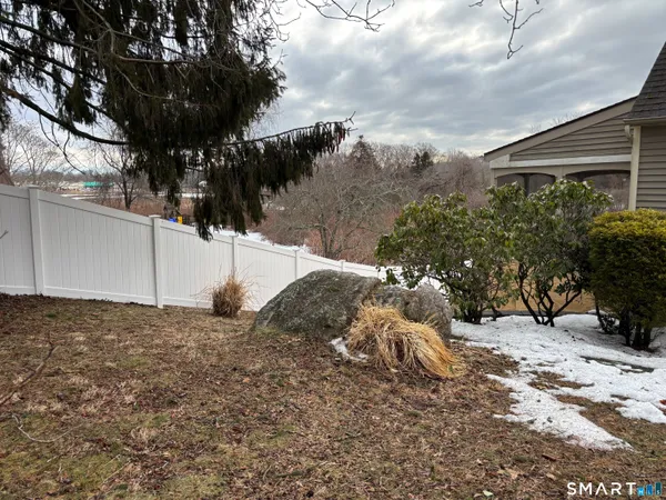 a view of a backyard of the house
