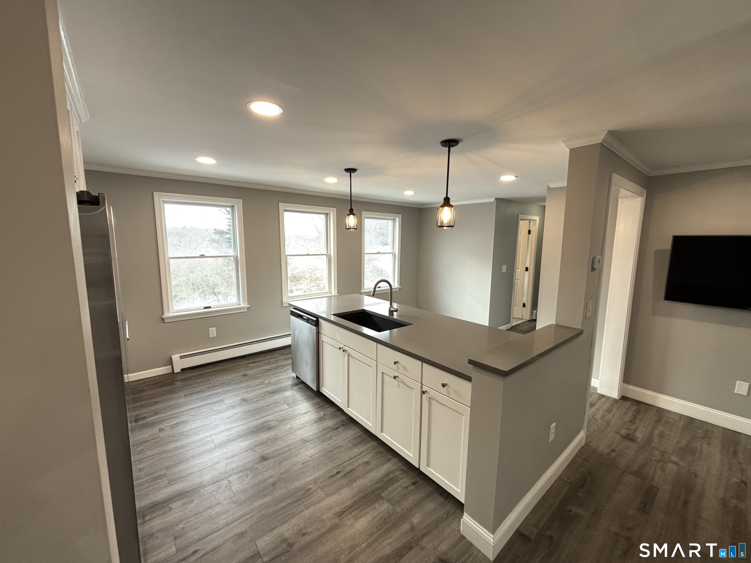 72 Ingham Hill Road Old Saybrook, CT 06475 - Photo 20 of 25 a large kitchen with stainless steel appliances granite countertop a large counter top a sink and a wooden floor