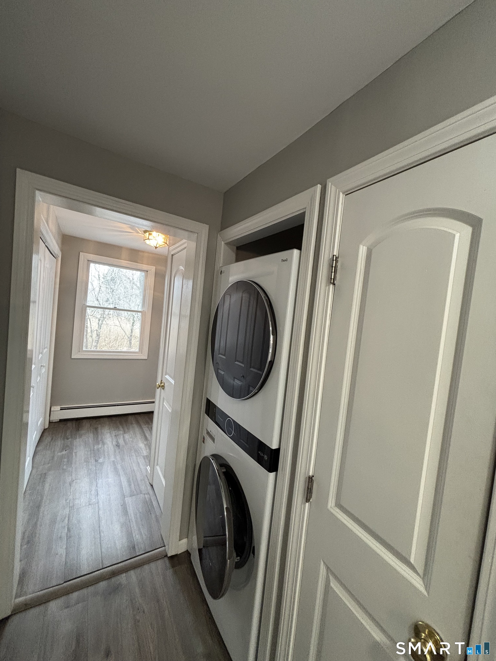 72 Ingham Hill Road Old Saybrook, CT 06475 - Photo 25 of 25 a view of a hallway with washer and dryer